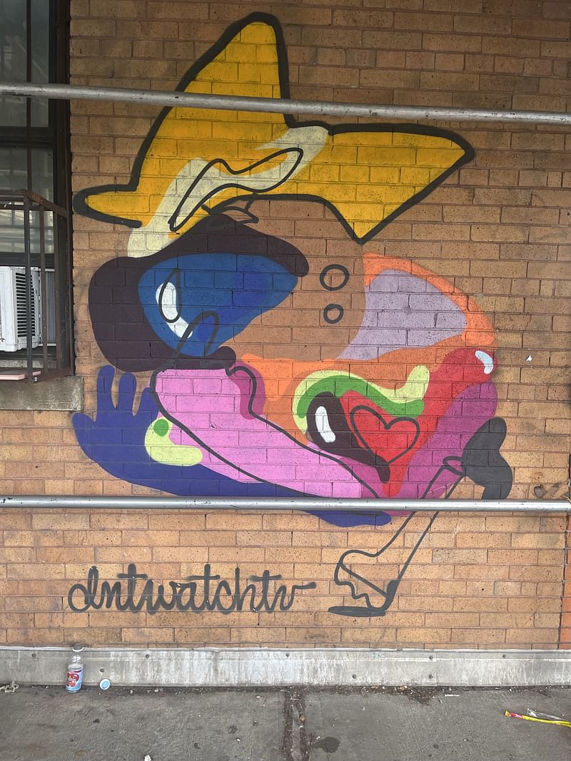 mural in Brooklyn by artist DNTWATCHTV.
