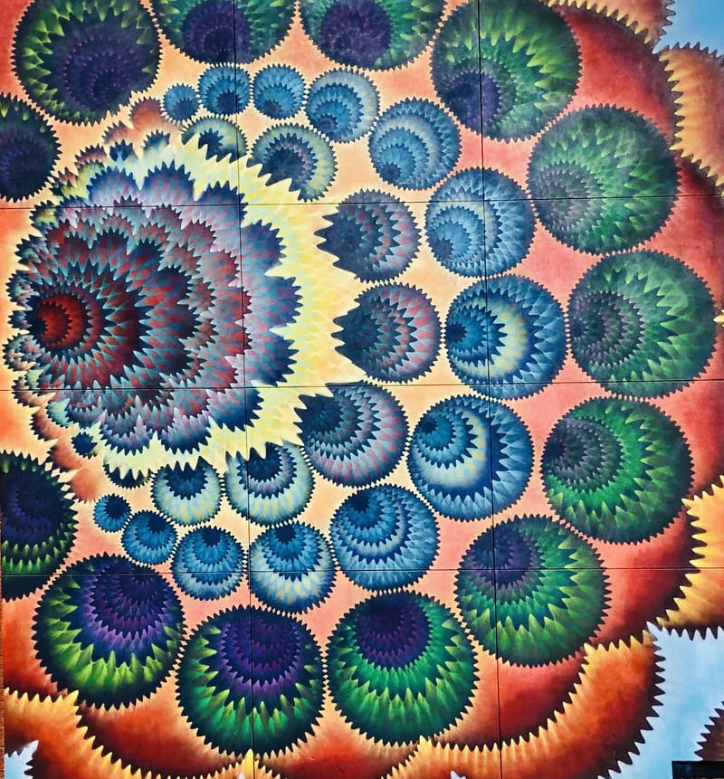 mural in Denver by artist Hoxxoh.